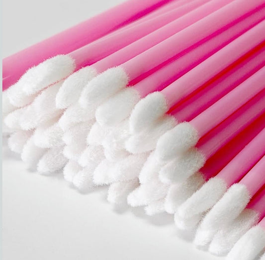 Pink standard lint-free lash applicators with soft white flocked tips by Velvet Lash Co. for professional eyelash extension application and prep.