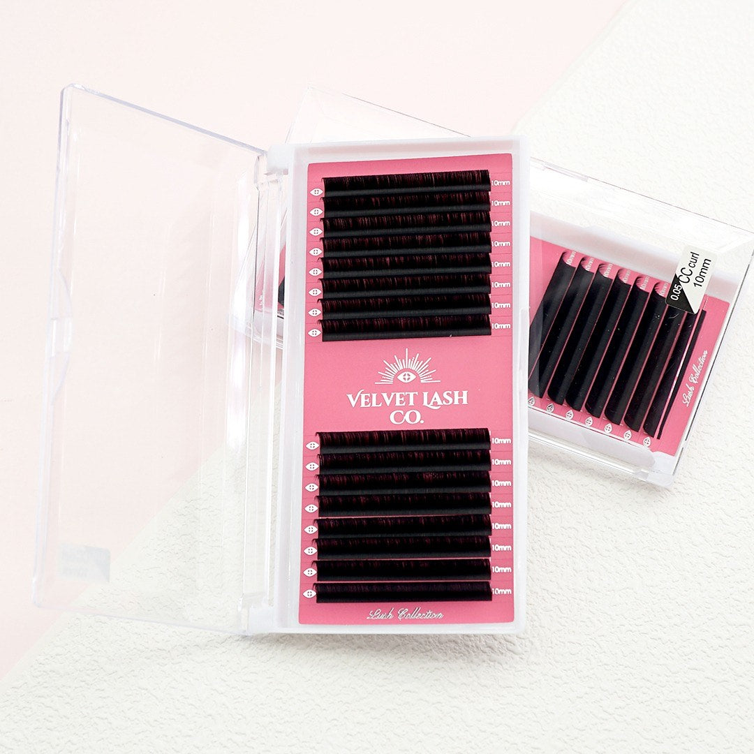 Pink packaging of Velvet Lash Co with false eyelashes on a white background. Lash extension kit